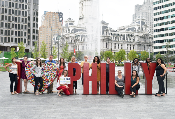 EAT RIGHT PHILLY 2019-2020 team standing in front of a fountain and City Hall.